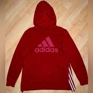 Women’s Red Adidas Sweatshirt. Slits with 3 white stripes on both sides.